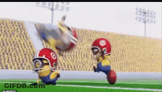 Two Minions Playing Football GIF