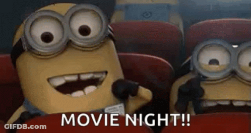 Two Minions Watching Movie In Theater GIF