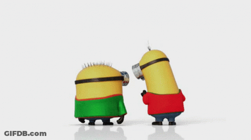 Two Minions Wearing Green And Red Sweaters Are Dancing Together GIF