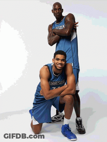 Two Minnesota Basketball Players Are Posing For A Picture GIF