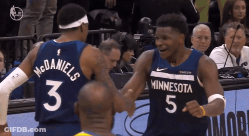 Two Minnesota Basketball Players Shake Hands GIF