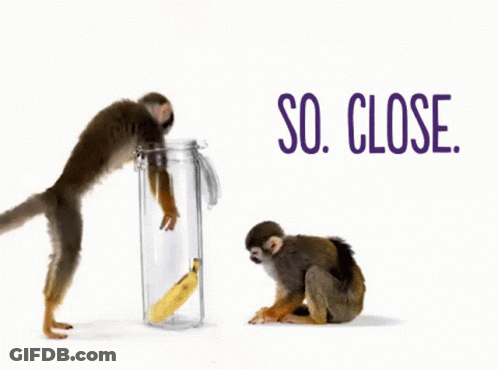 Two Monkeys Are Standing Next To A Jar With A Banana In It And The Words So Close Behind Them GIF