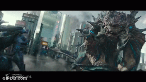 Two Monsters Are Fighting In A City In A Movie Clip . GIF