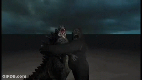 Two Monsters With Their Mouths Wide Open Are Standing Next To Each Other GIF