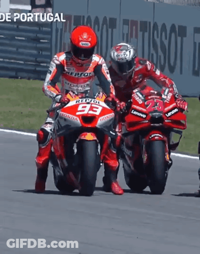 Two Motorcycle Racers Are Racing On A Track And One Has The Number 93 On The Front Of His Motorcycle GIF