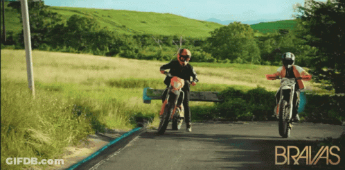 Two Motorcycle Riders On Road With Bravas GIF