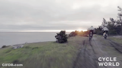 Two Motorcycles Riding Dirt Road GIF