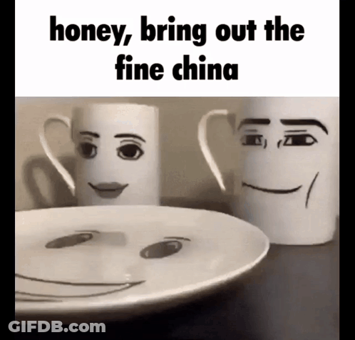 Two Mugs With Faces Drawn On Them Are Sitting Next To A Plate GIF