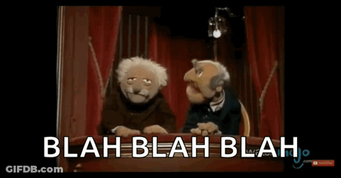 Two Muppets Are Sitting At A Table With The Words Blah Blah Blah Written On The Screen GIF