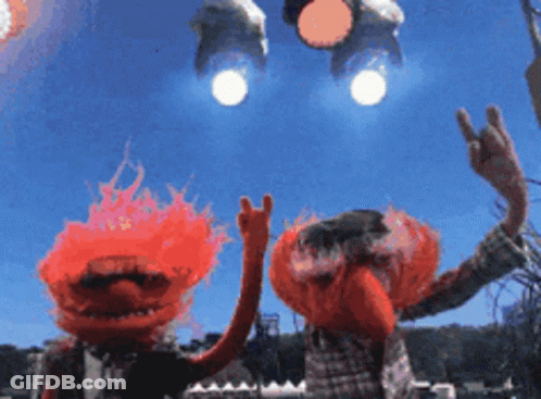 Two Muppets Are Waving Their Hands In The Air With A Blue Sky Behind Them GIF