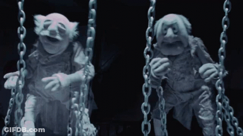 Two Muppets Chained Together One Laughing GIF