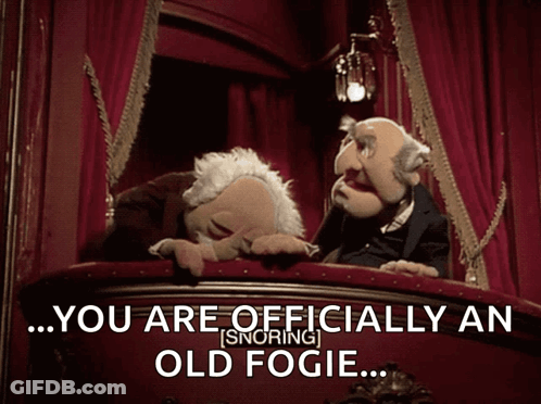 Two Muppets On A Balcony With The Words " You Are Officially An Old Fogie " Above Them GIF