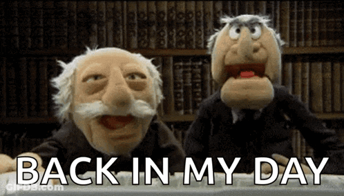Two Muppets Sitting In Front Of Bookshelf Back In My Day GIF