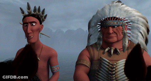 Two Native Americans Standing One With Feathered Headdress GIF