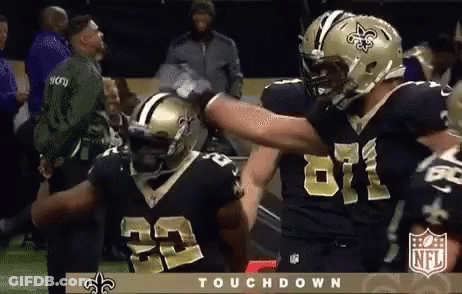 Two New Orleans Saints Players Hugging GIF