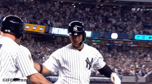 Two New York Yankees Baseball Players Are Hugging GIF
