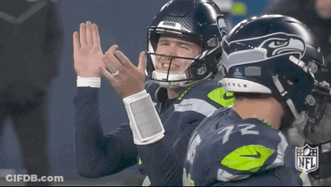Two NFL Football Players High-Fiving GIF