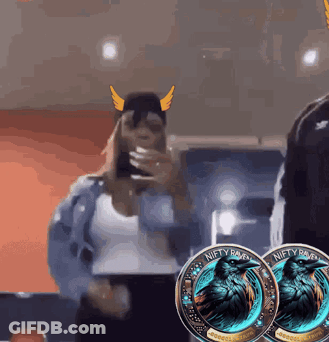 Two Niety Raven Coins Next To Woman In Viking Hat GIF
