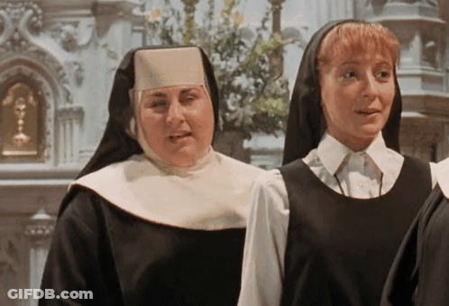 Two Nuns In Front Of Church GIF