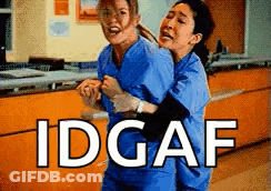 Two Nurses Are Hugging Each Other In A Hospital And The Words Idgaf Are Above Them . GIF