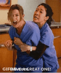 Two Nurses Are Hugging Each Other With The Words Have A Great One . GIF