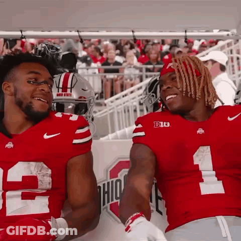Two Ohio State Football Players Smiling On Sidelines GIF