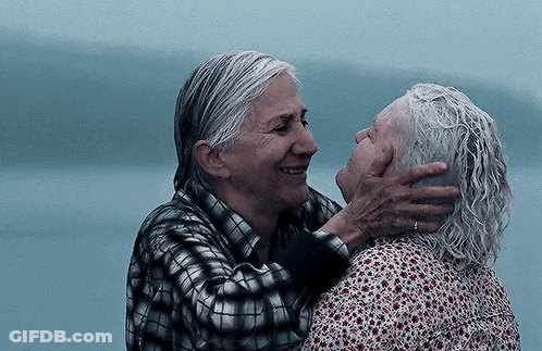 Two Older Women Are Hugging Each Other And Smiling . GIF