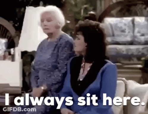 Two Older Women Are Sitting On A Couch And One Of Them Is Saying `` I Always Sit Here . '' GIF