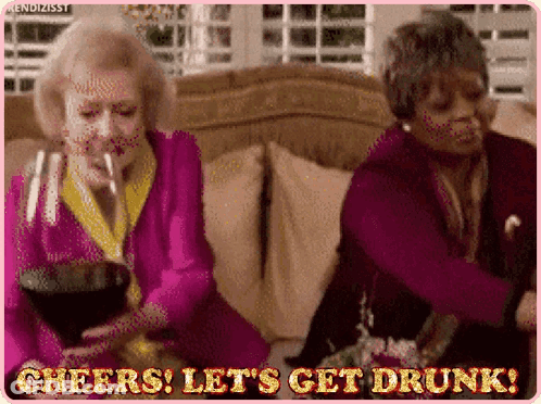 Two Older Women Drinking Wine And Dancing On Couch GIF