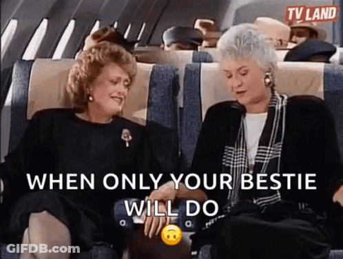Two Older Women Holding Hands And Laughing On Plane GIF