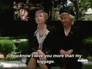 Two Older Women On Park Bench Saying You Know I Love You More Than My Luggage GIF