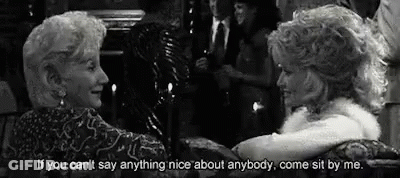 Two Older Women Sitting In Black And White Photo With Quote GIF