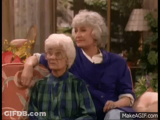 Two Older Women Sitting On A Couch GIF