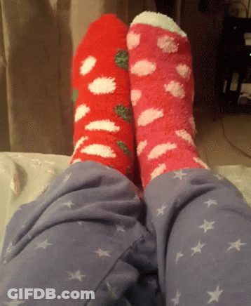 Two Pairs Of Socks On Feet GIF