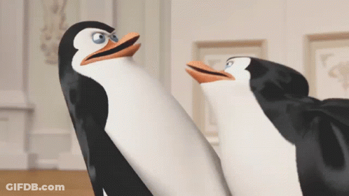 Two Penguins Are Standing Next To Each Other And Looking Up GIF