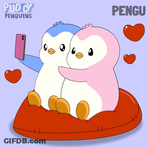 Two Penguins On Red Pillow One Taking Selfie GIF