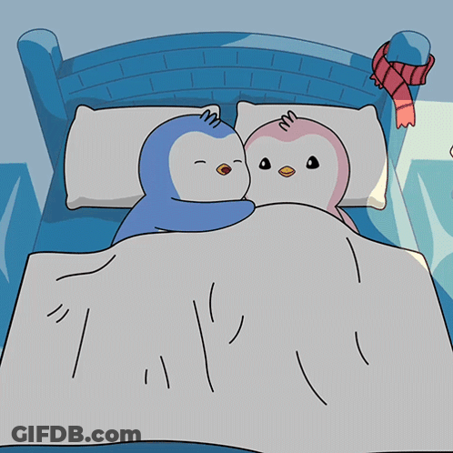 Two Penguins Sleeping In Bed GIF