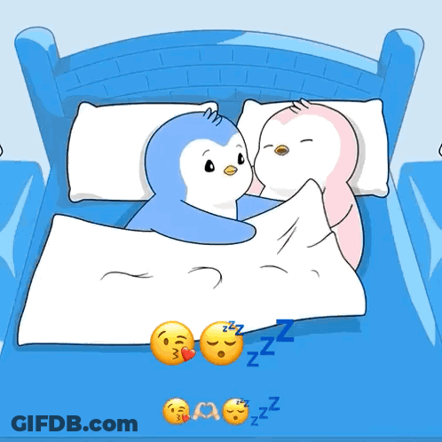 Two Penguins Sleeping In Bed With Zzz GIF