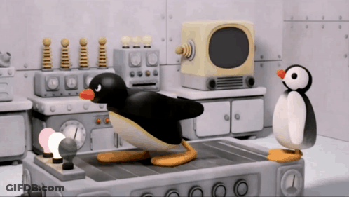 Two Penguins Standing Next To TV GIF