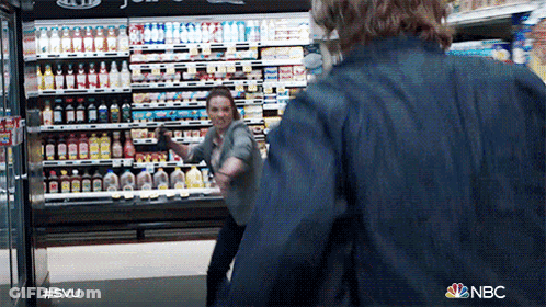 Two People Are Fighting In A Grocery Store And The Nbc Logo Is Visible GIF