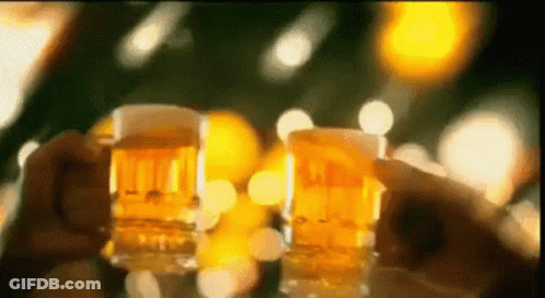 Two People Are Holding Glasses Of Beer In Their Hands . GIF