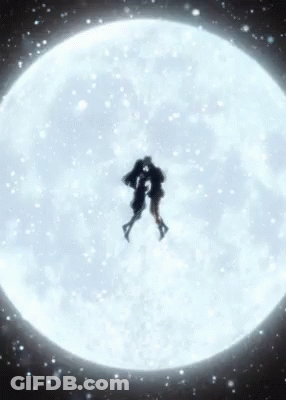 Two People Are Kissing In Front Of A Full Moon . GIF