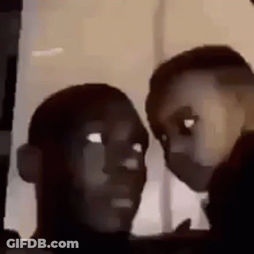 Two People Are Looking At Each Other Through A Window . GIF