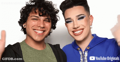 Two People Are Posing For A Picture And One Of Them Is Wearing A Youtube Originals Logo GIF