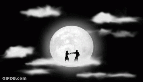 Two People Dancing In Front Of Full Moon GIF