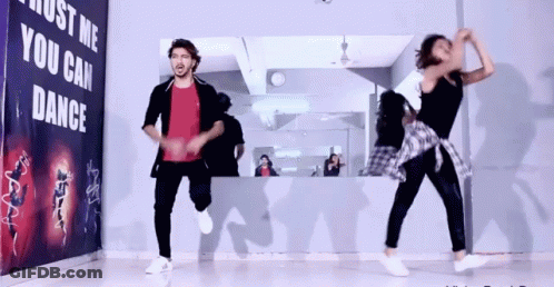 Two People Dancing In Front Of Just Me You Can Dance Sign GIF