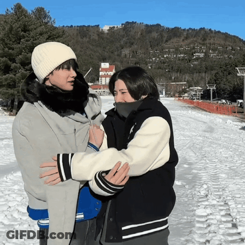 Two People Hugging In Snow GIF