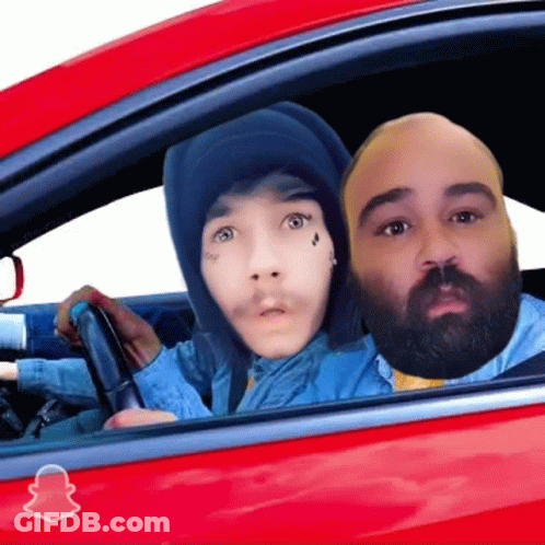 Two People In A Red Car With A Snapchat Logo On The Side GIF
