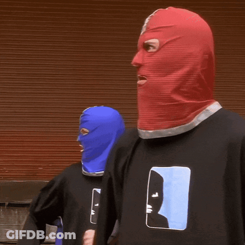 Two People In Balaclavas And Man T-Shirts GIF