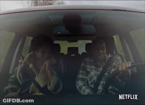 Two People In Car With Netflix Logo GIF
